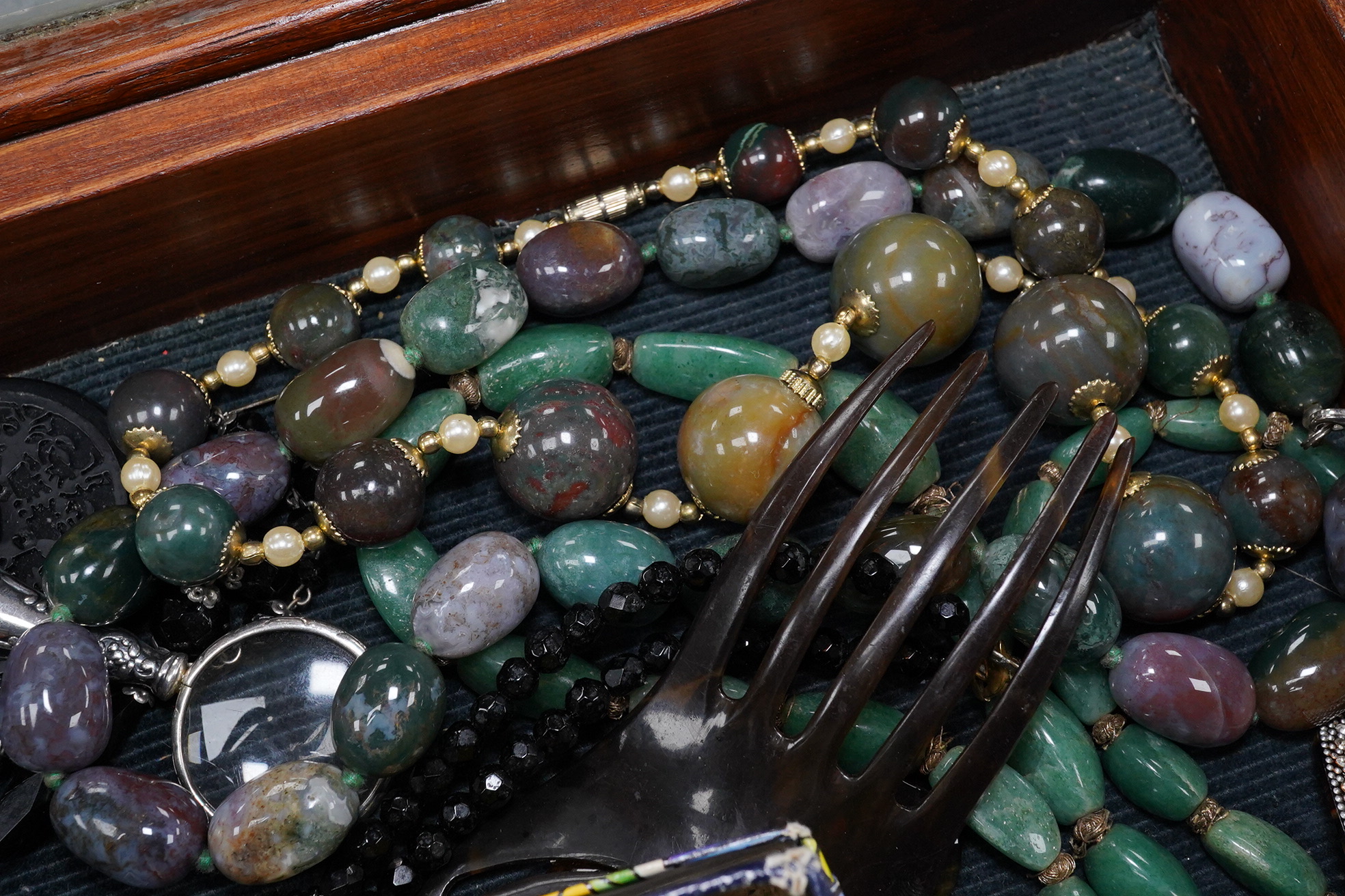 A group of assorted costume jewellery including an amber cigar holder and a Burberry gilt metal spaniel brooch